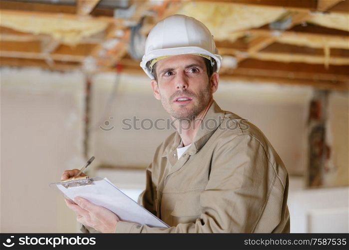 young handsome field engineer thinking