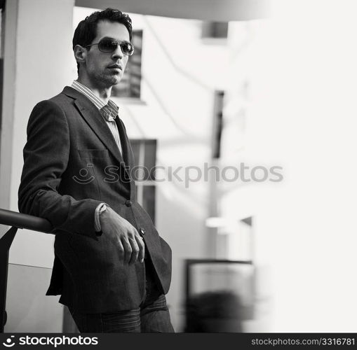 Young handsome guy posing in sunglasses