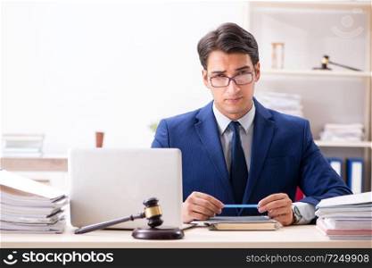 Young handsome judge working in court