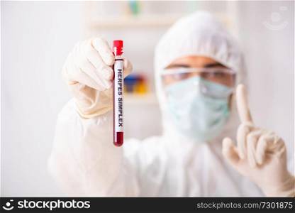 Young handsome lab assistant testing blood s&les in hospital 