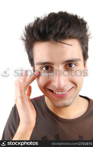 young handsome man applying eye cream (over white background)