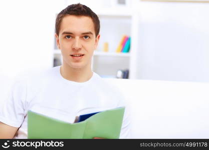 Young handsome man at home with a book. Z7+pOiRPAjR6xafPYkYbA2llwP5tADUfjRKINb6iQ8VRKi35K5SIwxtYGNtpNmIbeLWD64gzl360JHTHVRoxrk6+ZiixPiM/wgwjSQ6bi68QPz6YDdQLssO/NlCs0WgwskIqLAOxiebfnnxMQdfVGuTnRLOuSRj9XoHc8u2jvRVF+0qtO/5RmLr05a5I6uizZie5yS7ms2fhO7FPtmBGbxmYhWhj380EakwnUDloh8vPrXkf7ruFtIC+RwWdj7OfaluVUdZLerMacz7B0B1MoEWaBSIAgkA0cdpGKr/+z1685mgwbYHWfx6rvoUxf5jN