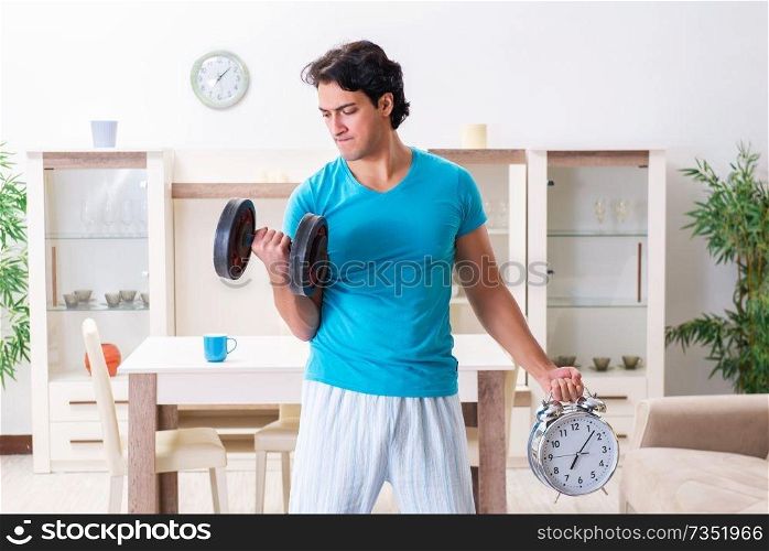 Young handsome man doing morning exercises 