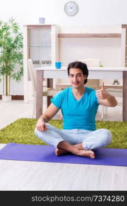 Young handsome man doing morning exercises 