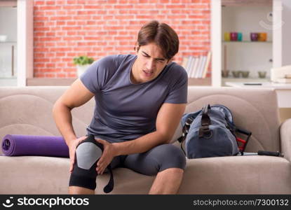 Young handsome man doing sport exercises at home  . Young handsome man doing sport exercises at home 