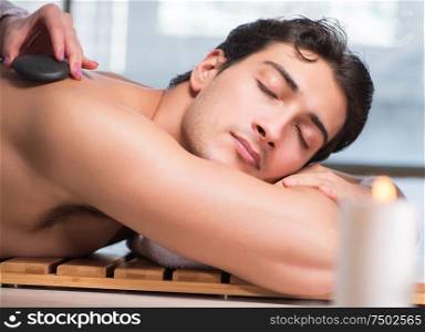 Young handsome man during spa procedure. The young handsome man during spa procedure