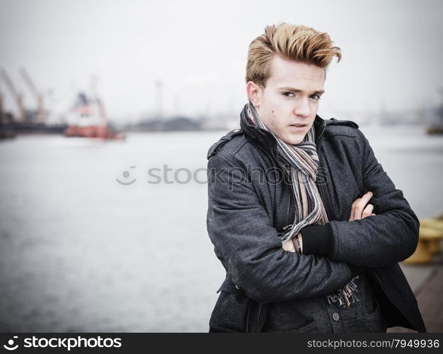 Young handsome man fashion model casual style on street industrial background