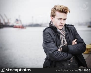Young handsome man fashion model casual style on street industrial background