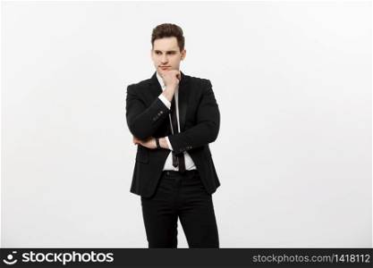 Young handsome man in black suit and glasses looking at copy-space smiling,thinking or dreaming isolated over white background.. Young handsome man in black suit and glasses looking at copy-space smiling,thinking or dreaming isolated over white background