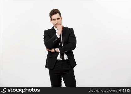 Young handsome man in black suit and glasses looking at copy-space smiling,thinking or dreaming isolated over white background.. Young handsome man in black suit and glasses looking at copy-space smiling,thinking or dreaming isolated over white background