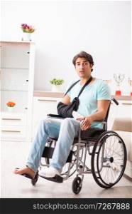 Young handsome man in wheelchair  