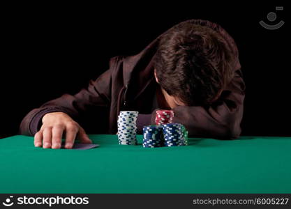 Young handsome man playing texas hold&rsquo;em poker