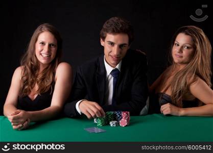 Young handsome man playing texas hold&rsquo;em poker