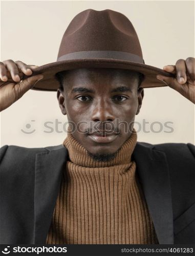 young handsome man posing with hat 10