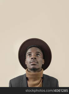 young handsome man posing with hat 7