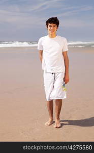 Young handsome man relaxing at the beach