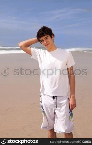 Young handsome man relaxing at the beach