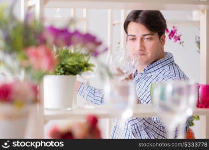 Young handsome man shopping in shop