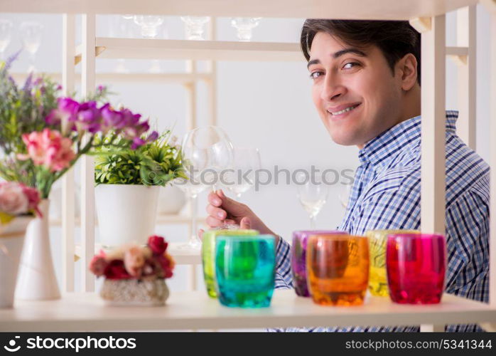 Young handsome man shopping in shop