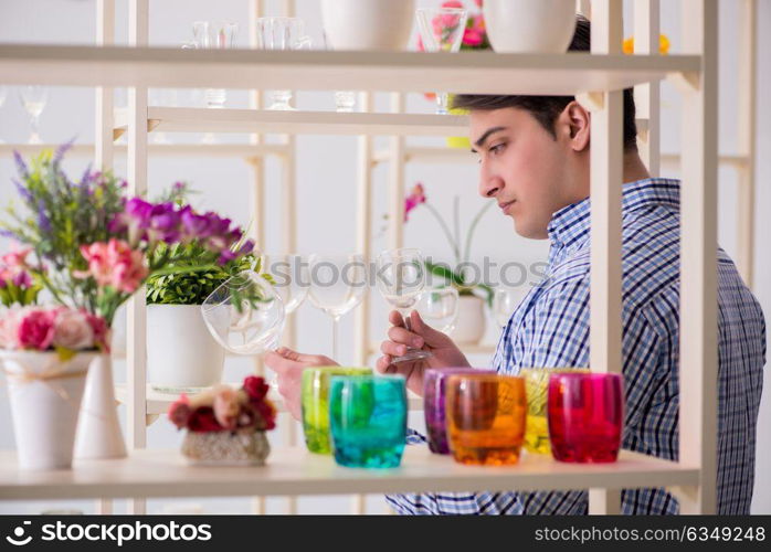 Young handsome man shopping in shop