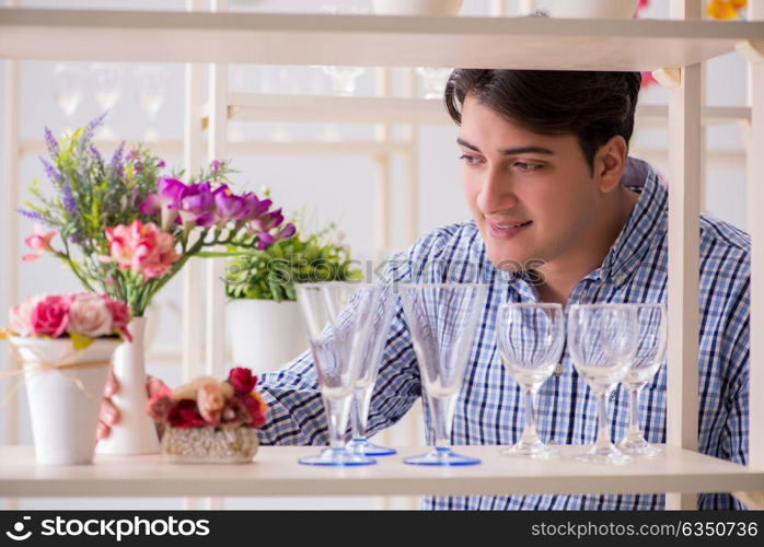 Young handsome man shopping in shop