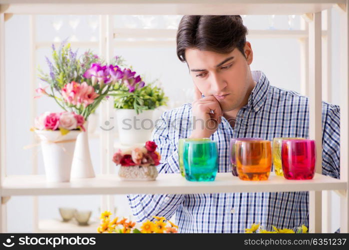 Young handsome man shopping in shop