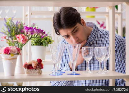 Young handsome man shopping in shop