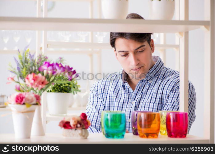 Young handsome man shopping in shop