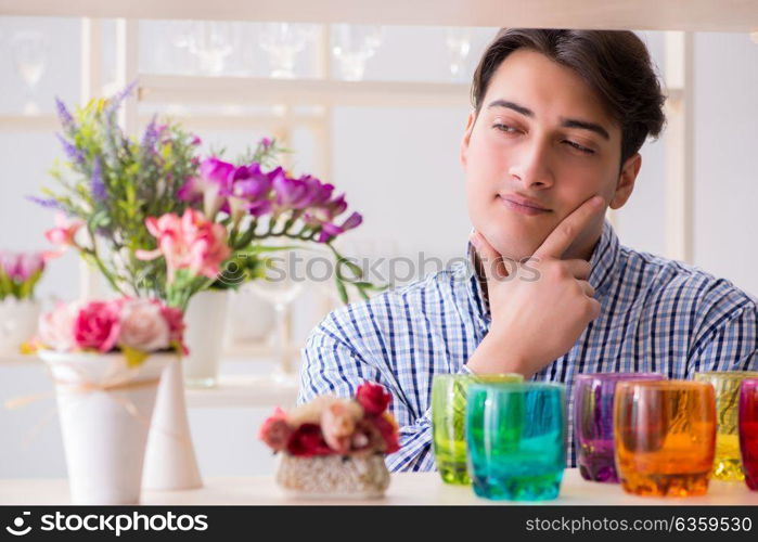 Young handsome man shopping in shop