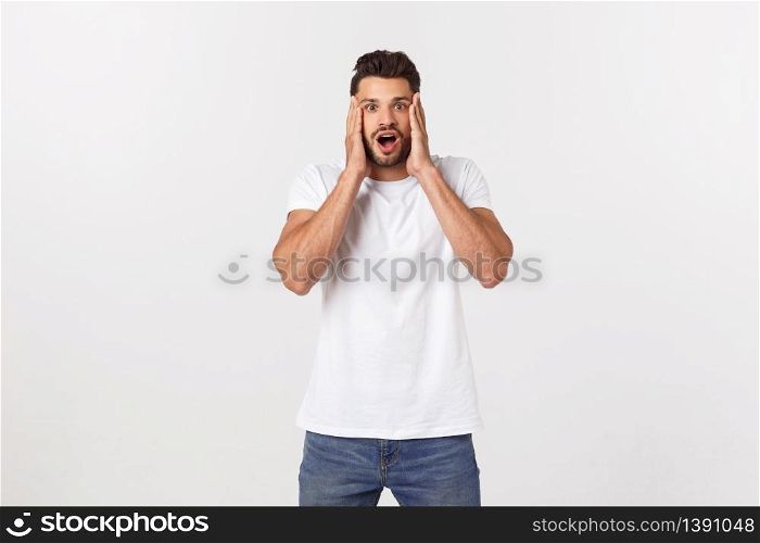 young handsome man shouting aggressively, looking very angry, frustrated, outraged or annoyed, screaming. Isolated over white background. young handsome man shouting aggressively, looking very angry, frustrated, outraged or annoyed, screaming. Isolated over white background.