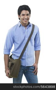 Young handsome man standing over white background