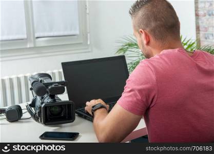 young handsome man using a computer in the office