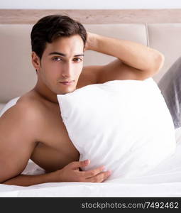 Young handsome shirtless guy showing nude torso sexy on bed at home. Young handsome shirtless guy showing nude torso sexy on bed at h