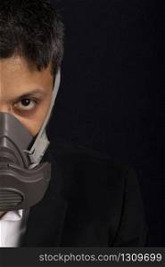 Young handsome with industrial mask to prevent the spread of contagious viruses or chemical gases
