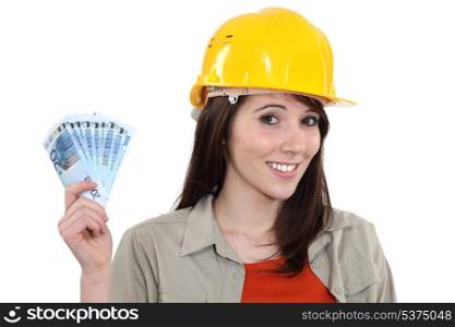 Young handy woman holding wage