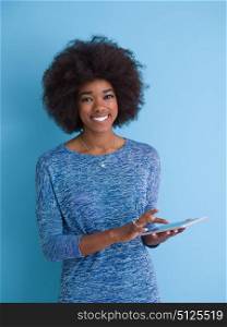 Young Happy African American Woman Using Digital Tablet Isolated on a blue background
