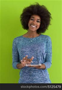 Young Happy African American Woman Using Digital Tablet Isolated on a green background