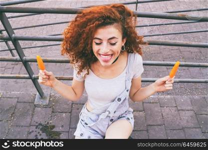 Young happy and redhead woman with a funny face