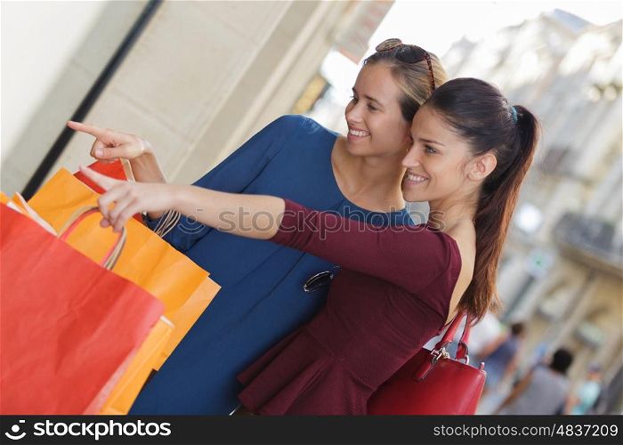 young happy and wealthy women shopping