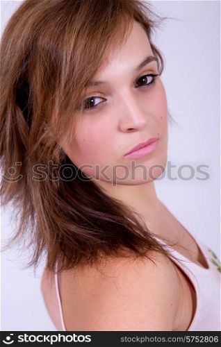 young happy beautiful woman on a grey background