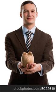 Young happy business man holding piggybank over white background