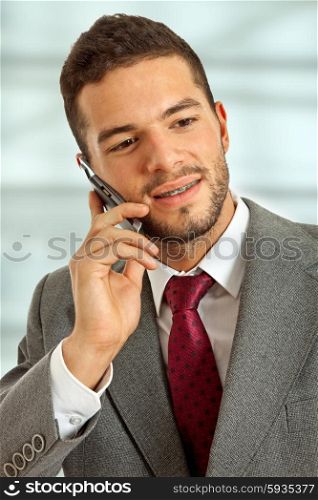 young happy business man on the phone
