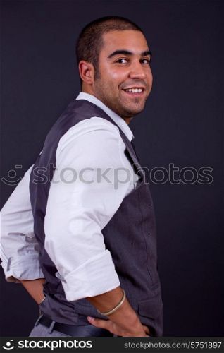 young happy businessman, on a black background