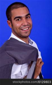 young happy businessman, on a blue background