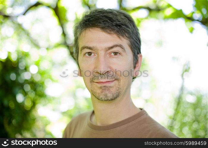 young happy casual man portrait, outdoors, bokeh picture