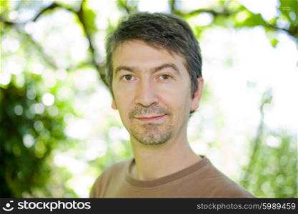 young happy casual man portrait, outdoors, bokeh picture