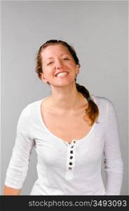 young happy caucasian woman on grey background