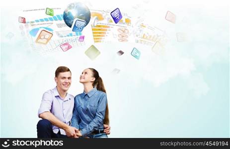 Young happy couple. Conceptual image of young couple hugging each other and dreaming. Elements of this image are furnished by NASA