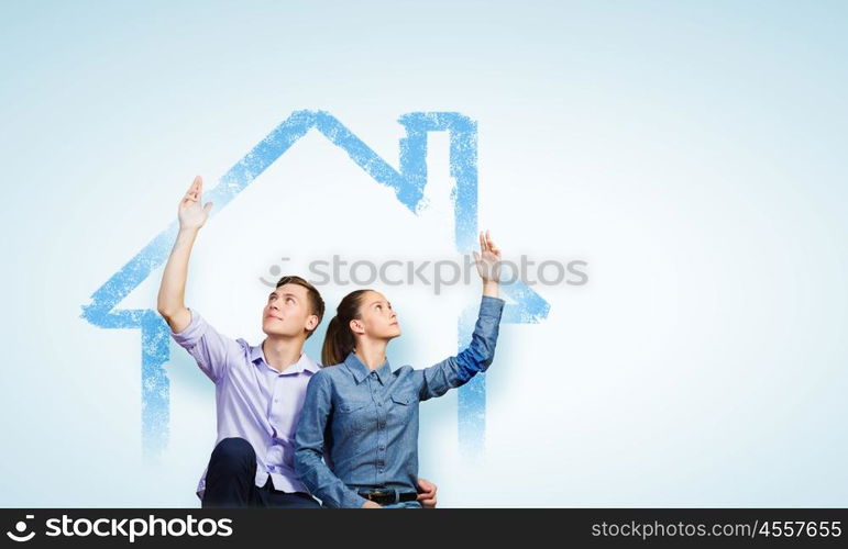 Young happy couple. Conceptual image of young couple hugging each other and dreaming