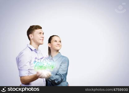 Young happy couple. Conceptual image of young couple hugging each other and dreaming